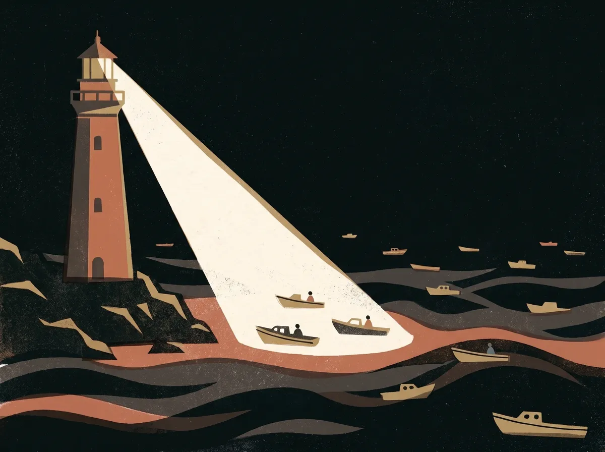 A lighthouse at night, its beam lighting three small boats while many others sit in darkness on the sea.