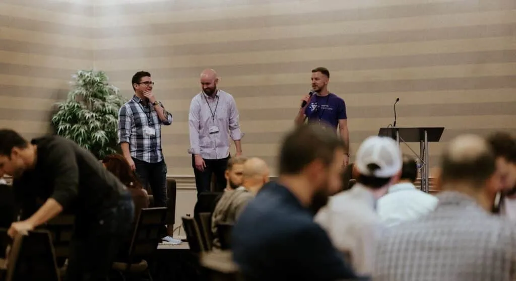 The three Traffic Think Tank cofounders on stage in front of the live audience.